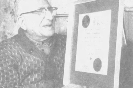 Artin Kirkonian receiving the framed certificate from the federal government for Canadians 100 years old and older.png